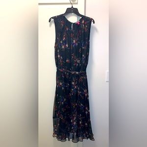Floral dress by Vince Camuto. Sleeveless. Sash belt tie. Lined.